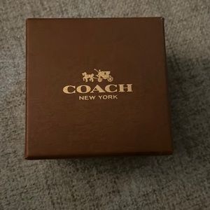 Coach watch new never worn. Brown leather.Comes with original box and pillow